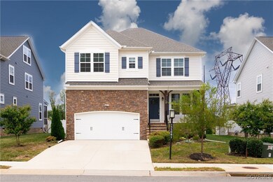 View of front of house featuring a porch, a garage