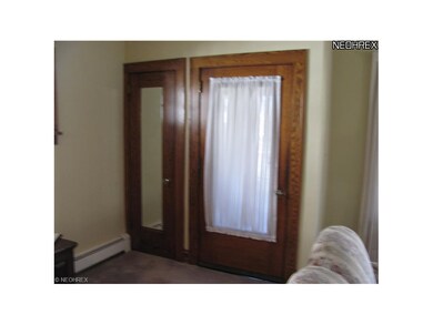 View of living room guest closet.