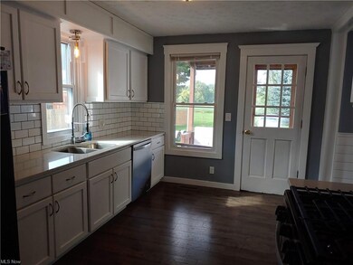 Kitchen opens to the back porch and large backyard