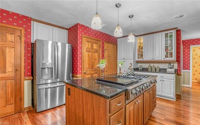 High-end stainless-steel appliances include a Jenn