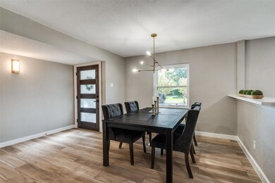 Dining area with an inviting chandelier and light 
