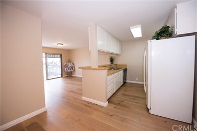 New large plank wood floors throughout the kitchen