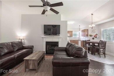 Great room, dining area, and kitchen.  Cathedral c
