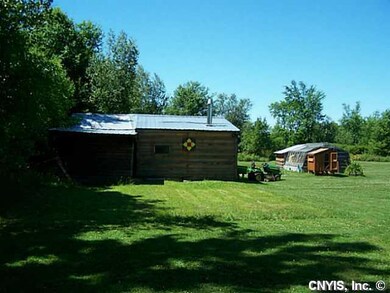 Backyard. View of all out buildings.