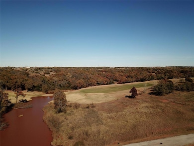 Bird's eye view of a large body of water and a golf course