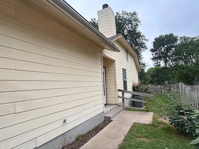 View of property exterior with entry steps, centr