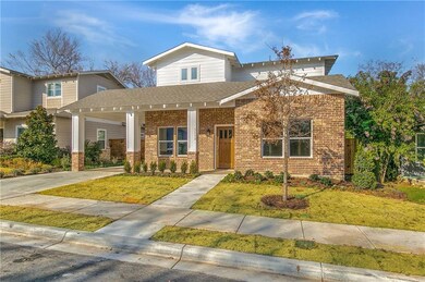 Front view with front porch and landscaping