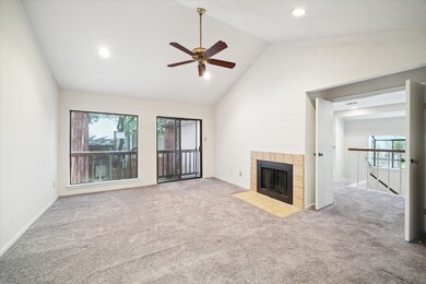 Upstairs primary bedroom with woodburning fireplac