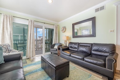 Living room with hardwood / wood-style floors and 
