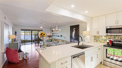 Newer white shaker cabinets and quartz countertops bring timeless style and a bright, airy feel.
