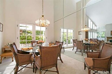 A formal dining room with beautiful French doors.