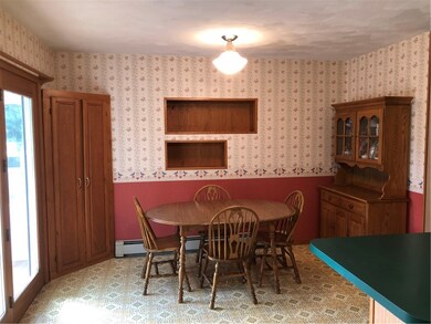Dining area leading out to sun room.