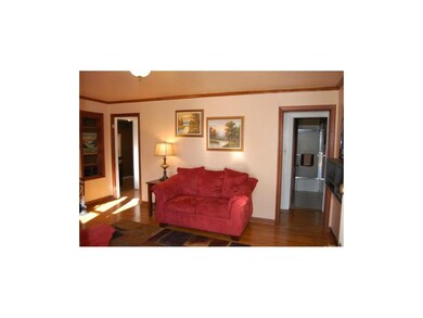 Inviting Living Room with Hardwood Floors and Cozy