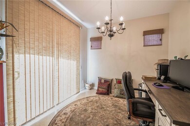 Features formal dining room or den/office with sli