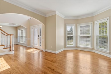 Entrance foyer with light wood-type flooring, stai