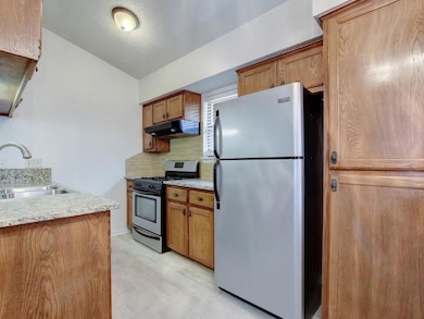 Kitchen with stainless steel appliances, under ca