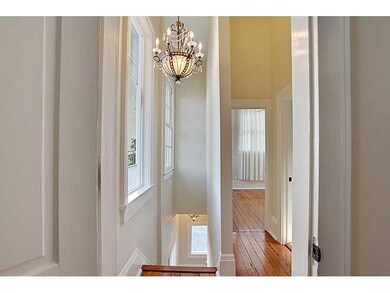 Stairwell. Four large windows on the staircase lea