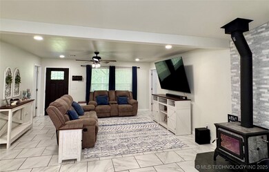Spacious living area featuring a stunning wood-bur
