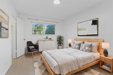 Bedroom featuring light tile patterned floors and