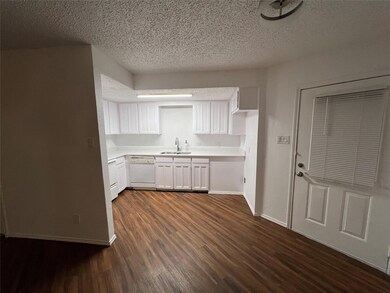 Kitchen featuring dark hardwood / wood-style floor