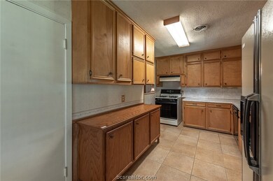 Tons of cabinets in this great kitchen!