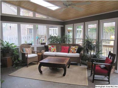 Light and bright sunroom with vaulted ceilings and