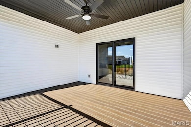 Wooden terrace with a ceiling fan