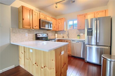 Brand new quartz counter tops and travertine tile