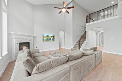 The expansive two-story living area boasts a strik