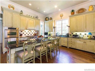 Notice the beautiful granite countertops and custo
