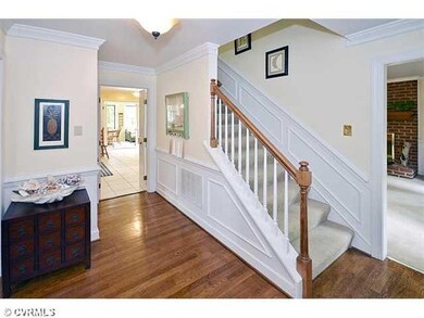 Foyer - Foyer with Wood Flooring & Heavy Moldings