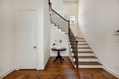 Large foyer with herringbone floors