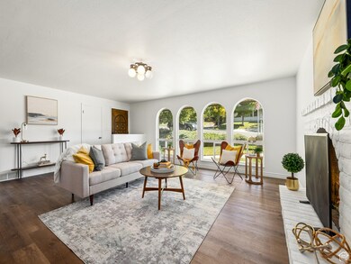 Living area featuring a fireplace and dark wood finished floors