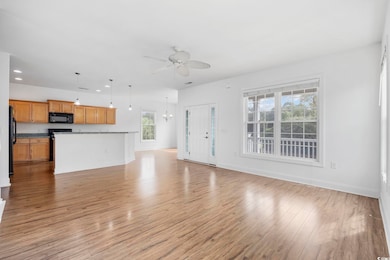 Unfurnished living room with light wood finished f