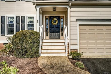 Welcoming covered front entryway with TimberTech t