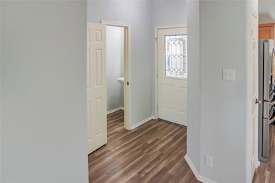 Foyer entrance featuring dark wood finished floor