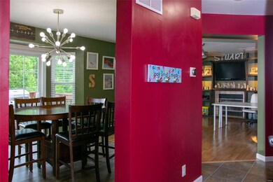 Enter into the dining area and family room - lots of light and space for the whole family!