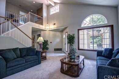 ANOTHER ANGLE OF THE LIVING ROOM AND ENTRY