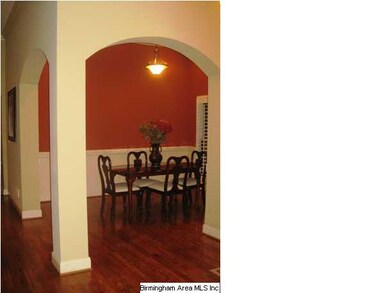 Graceful arches compliment the open floor plan and