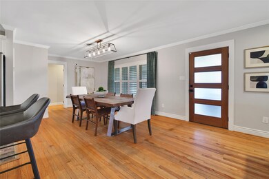 Formal dining space can fit a large table for gath