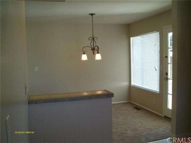 Dining area with door into back yard.