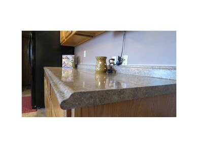 Kitchen. NEW COUNTERS WITH MOULDED EDGE IN A NEUTR