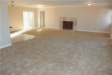 Features include travertine faced fireplace, crown