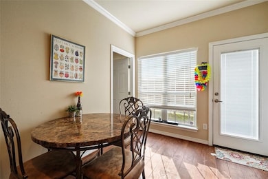 Cozy dining nook filled with natural light, ideal for meals or study sessions. (Unit 203)
