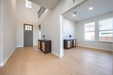 Entrance foyer featuring light wood-style flooring and recessed lighting