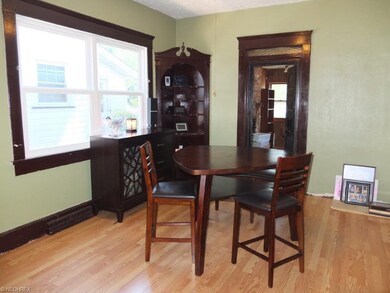 Formal dining room with built-in corner cabinet.