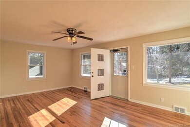 Sunny large living room with newly refurbished ori