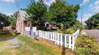 Private driveway with gate to backyard and lots of parking.