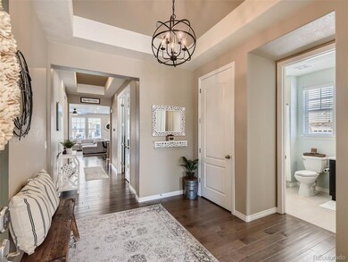 Inviting foyer with updated lighting.