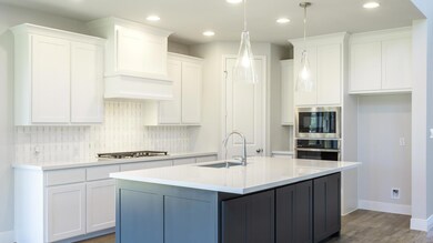 Kitchen with a sink, stainless steel appliances, 